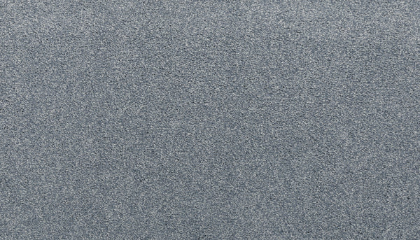 A close-up view of the Noble Surface Pet Friendly Carpet in Hydrangea color, showcasing its durable, textured gray surface with a uniform, grainy appearance.