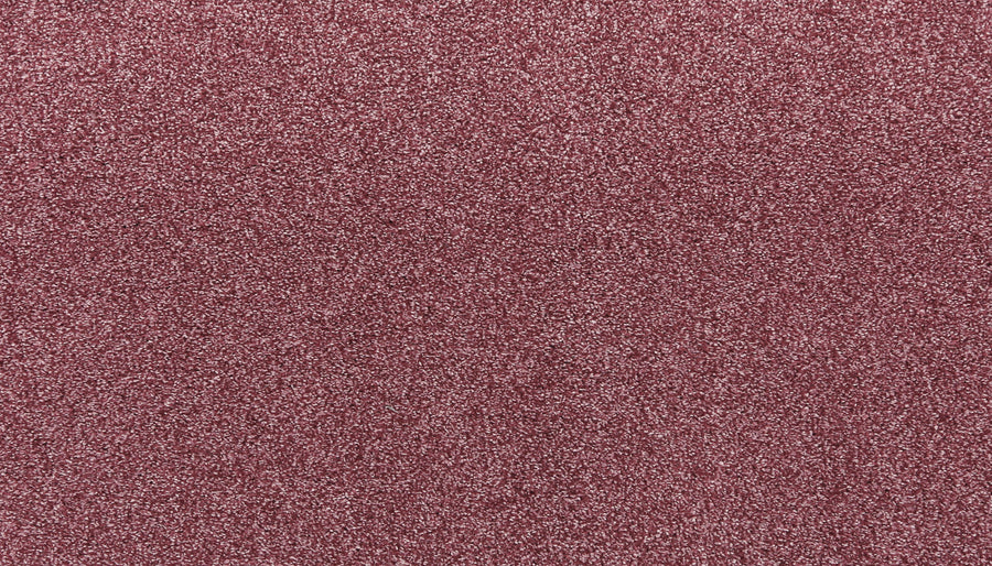Close-up of Noble Tone Pet Friendly Carpet in Sangria, displaying its fine reddish-pink glitter texture for a sparkling look—perfect for showcasing its stain-resistant, dazzling appearance that's also pet friendly.