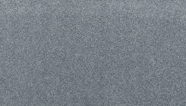 A close-up view of Noble Tone Pet Friendly Carpet in Hydrangea, featuring a textured gray surface with a subtle shimmer and durable, grainy pattern—ideal for resilient flooring in pet-friendly homes.