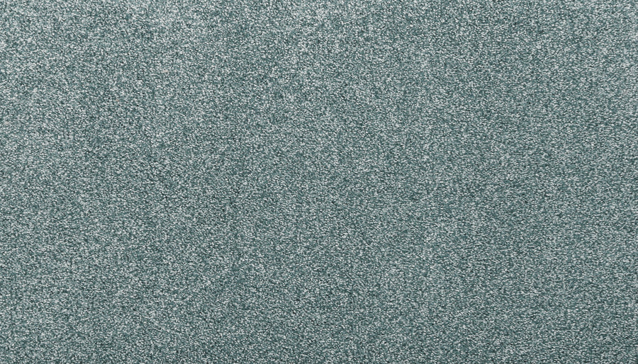 A close-up of Noble Tone Pet Friendly Carpet in Sea Mist shows its textured, stain-resistant surface with fine, sparkling glitter that creates a shimmering effect.