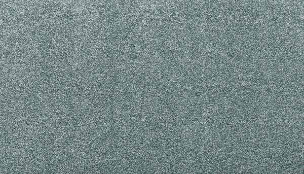 A close-up of Noble Tone Pet Friendly Carpet in Sea Mist shows its textured, stain-resistant surface with fine, sparkling glitter that creates a shimmering effect.