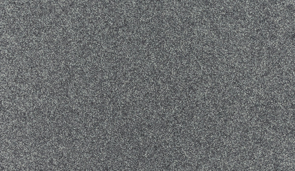 A close-up of Noble Tone Pet Friendly Carpet in Shilling shows a grey, speckled texture with fine light and dark particles—perfect for durable, pet-friendly flooring.
