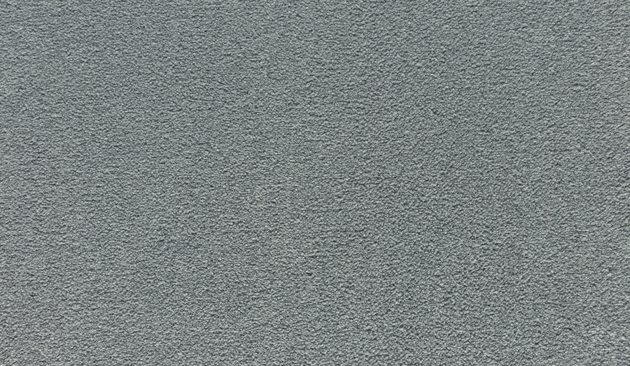 Close-up of Noble Tone Pet Friendly Carpet in Morning Dew, featuring a textured, light gray, stain-resistant surface with a soft, even pile and subtle speckling.