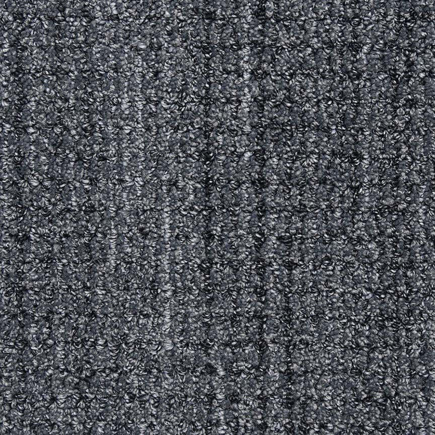 Close-up of Aspen Berber Carpet in Nocturne shows a soft, dense, and durable textured looped surface with subtle vertical lines in varying gray shades.