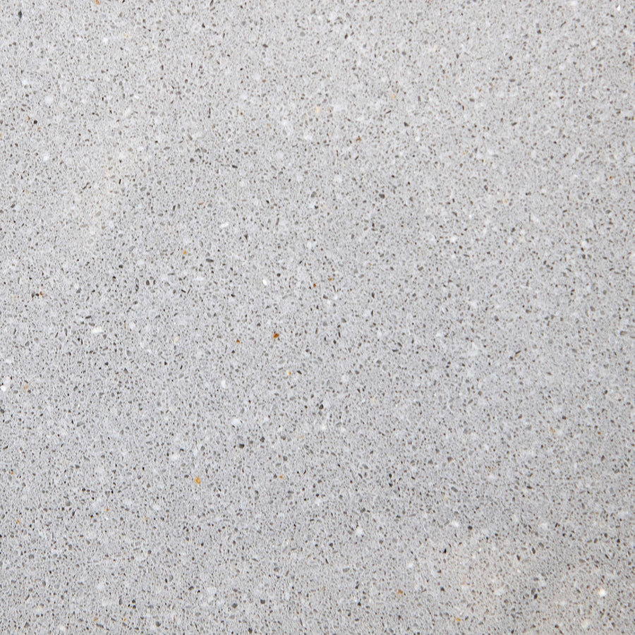 Close-up of smooth, light gray concrete with subtle specks—an ideal backdrop for mounting the modern Quad Shower Shelf in your bathroom.