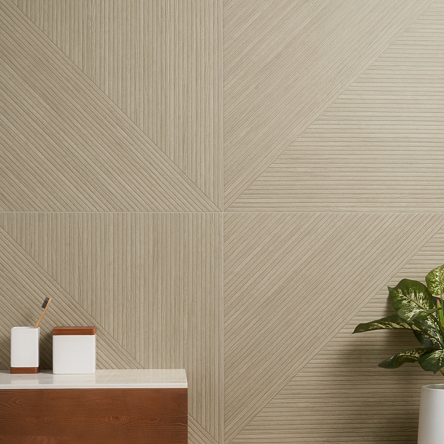 A modern interior with a geometric beige wall pattern, a wooden cabinet with white and brown containers, and a green potted plant on the right side.