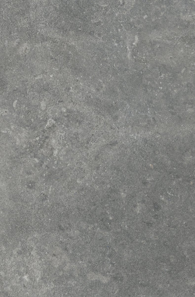 A close-up of the VersaTILE 16x24 Glazed Porcelain Tile in Pyreneese Summit shows a gray stone look with a rough texture, subtle color variation, white specks, and natural patterns—ideal for bringing a touch of luxury to any room.