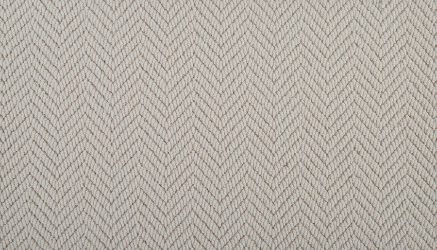 Close-up of Bespoke On Trend Carpet in light beige, featuring a textured fabric with a herringbone pattern and thin V-shaped diagonal lines—ideal for creating a stylish, custom look.