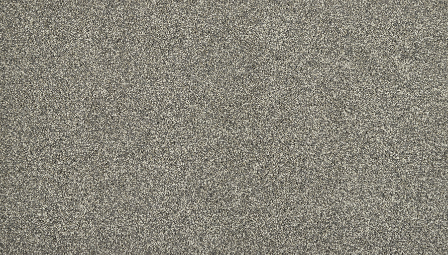 A close-up of Meridian Family Friendly Carpet highlights its refined grey speckled texture, offering durable and understated luxury—an ideal choice for any home.