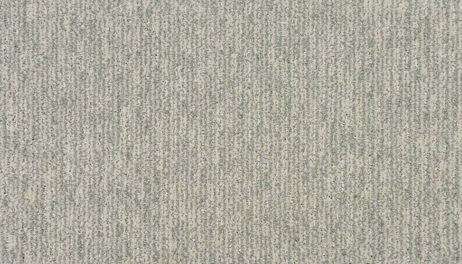 Close-up of Luxurious Retreat Pet Friendly Carpet in light gray, featuring a subtle linear pattern with alternating gray and off-white tones for a soft, modern look.