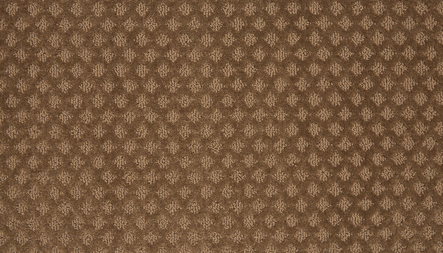 Close-up of Retro Revival Pet Friendly Carpet in brown, featuring a repeating diamond-shaped textured pattern that creates a raised, three-dimensional effect across the surface.