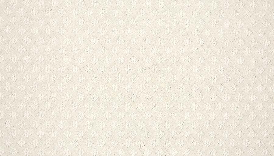 A close-up of Retro Revival Pet Friendly Carpet shows its light beige textured fabric with a subtle, repeating diamond or leaf-like pattern—perfect for those seeking style, comfort, and durability in a pet-friendly carpet.