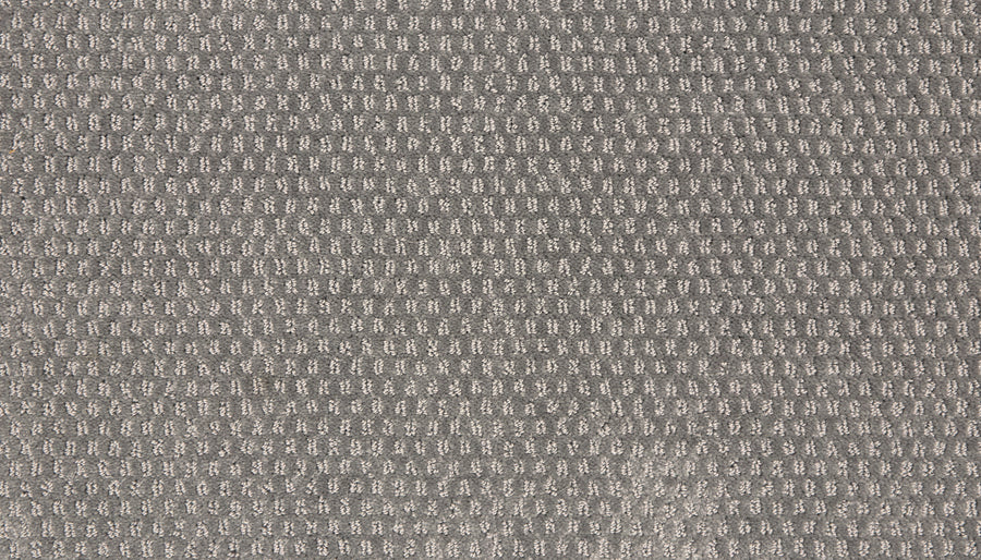 Close-up of the Vintage Manner Pet Friendly Carpet in gray, featuring a soft, textured surface with a small repeating square waffle weave pattern, reminiscent of luxury fabrics and ideal for stylish, pet-friendly homes.