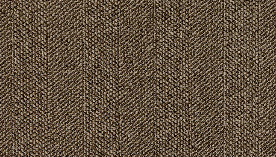 Close-up of Motley On Trend Carpet, showcasing brown textured fabric with diagonal lines and a subtle herringbone pattern. The weave adds depth and a soft, slightly raised surface for a premium look and feel.