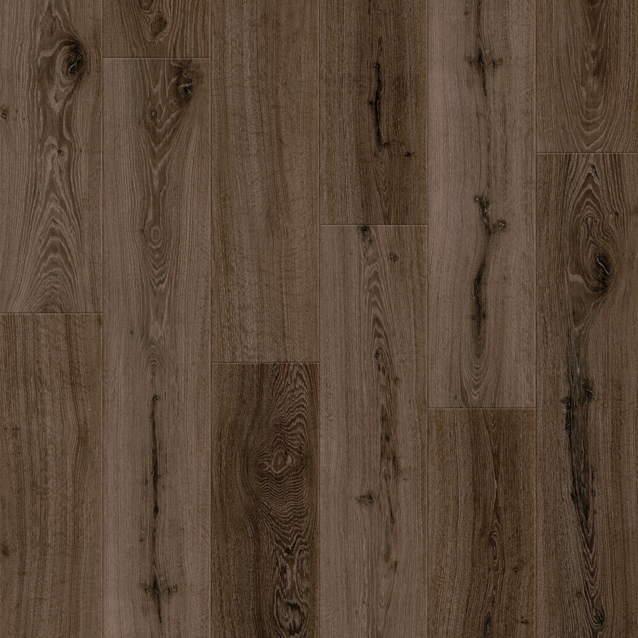Close-up of Coretec Retro Revival 9" Vinyl Plank in Obsidion Oak, showing natural grain and knots in a staggered layout. This durable vinyl flooring has a matte finish and delivers a slightly rustic, vintage look.