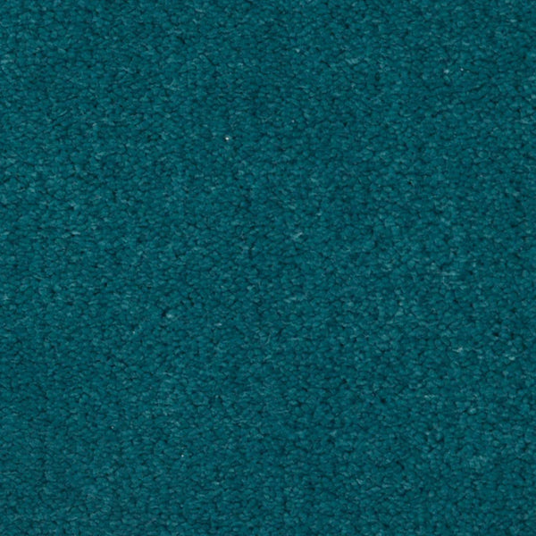 Close-up view of the Seduction On Trend Carpet in Ocean Soul, featuring a textured teal surface with a soft, slightly fuzzy appearance.