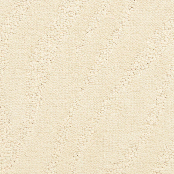 Close-up of Capetown On Trend Carpet in Old Town Hall color, featuring a cream tone with a subtle wavy diagonal pattern from raised and looped fibers. Its soft, uniform texture and gentle variations suit high-traffic areas.