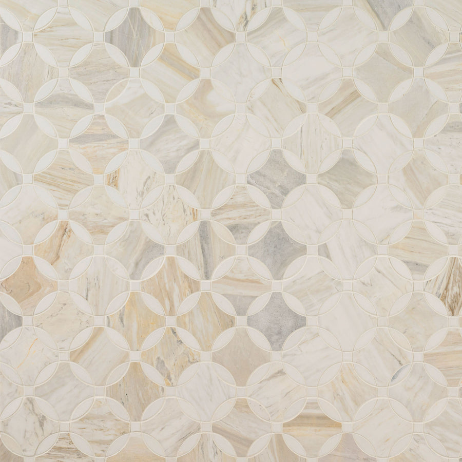 The Olympia Sandalwood Palacial Polished Marble Mosaic features interlocking circles and diamond shapes in beige, gray, and cream tones, creating a refined geometric pattern on a luxurious light-colored tile.
