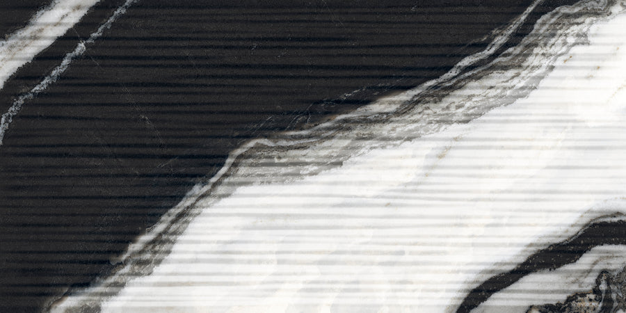 Close-up of a marble surface with wavy, contrasting black and white veins running diagonally, featuring subtle horizontal lines across the image. The texture appears smooth and polished.