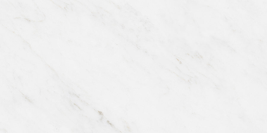 White marble surface with subtle gray and beige veining, creating a smooth and elegant natural stone texture.