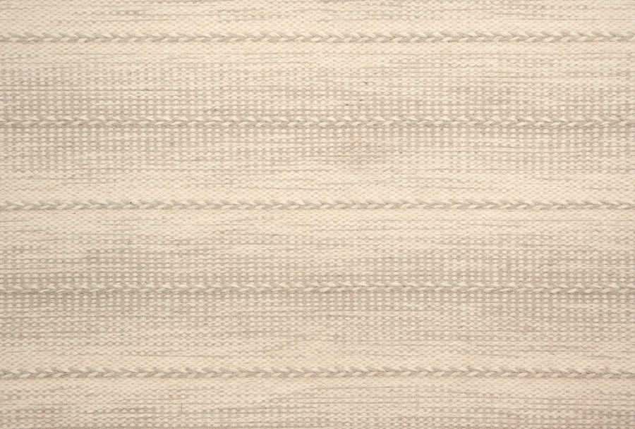 Orzola On Trend Carpet features beige woven fabric with subtle horizontal stripes and light gray textured patterns, offering a soft, neutral, and minimalist design ideal for modern interiors.