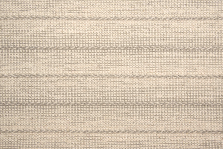 A close-up of Orzola On Trend Carpet reveals a beige woven fabric with subtle horizontal gray stripes and a textured, grid-like pattern—ideal for modern interiors and contemporary design.