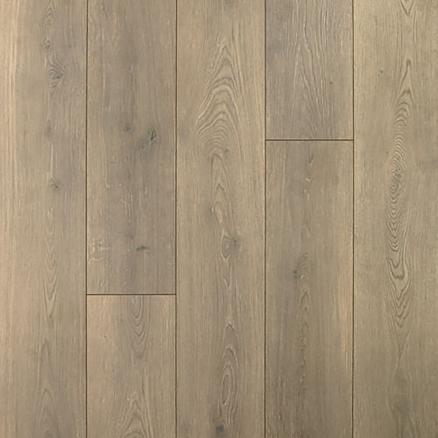 The Beachside Collective 7 1/2" Waterproof Laminate in Outerbanks features light brown planks with natural grain and subtle knots, a smooth matte finish, and a gently weathered look—ideal for coastal-inspired spaces.