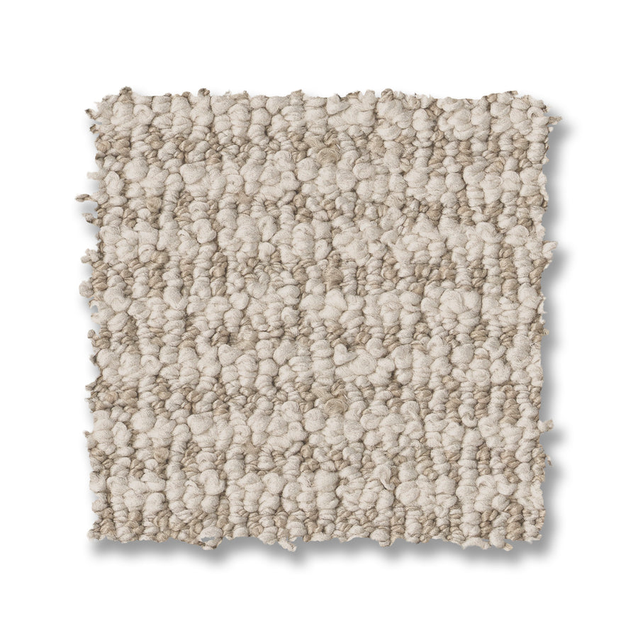A square swatch of Laine On Trend Carpet, featuring a textured light beige loop pile and bumpy surface, is displayed on a white background.