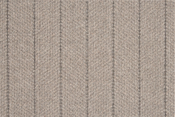 The Pacific Stripe On Trend Carpet in Ash is a modern, light brown textured carpet with a subtle herringbone pattern and thin, evenly spaced vertical dark lines for an elegant striped look.