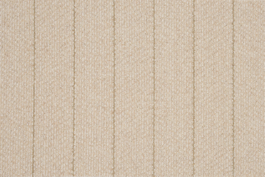 Close-up of the Pacific Stripe On Trend Carpet in Natural, featuring beige textured fabric with vertical, evenly spaced stitched lines for a soft, subtly raised striped pattern and contemporary look.