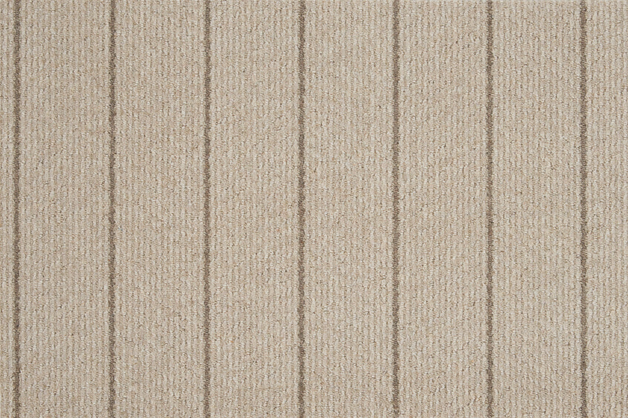 Pacific Stripe On Trend Carpet in Prairie features a textured surface with evenly spaced vertical lines, delivering contemporary style through its elegant striped design.