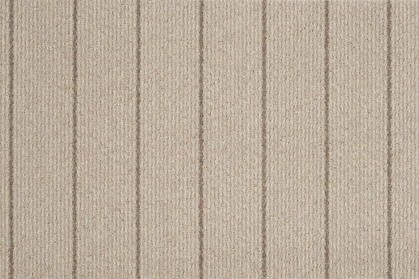 Pacific Stripe On Trend Carpet in Prairie features a textured surface with evenly spaced vertical lines, delivering contemporary style through its elegant striped design.