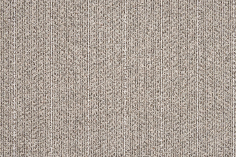 Close-up of Pacific Stripe On Trend Carpet in Quartz, showcasing a beige contemporary herringbone texture with evenly spaced vertical white stripes for a modern, striped look.
