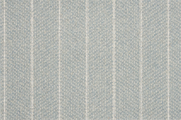 The Pacific Stripe On Trend Carpet in Surf features a light blue textured fabric with a subtle herringbone pattern and evenly spaced vertical white stripes, offering a contemporary look and a soft, woven surface.