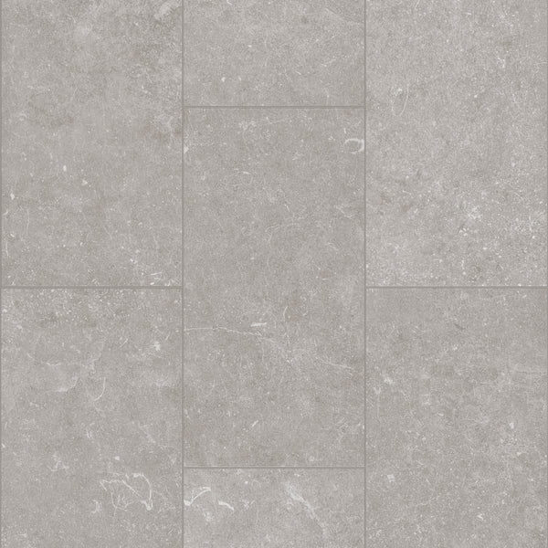 Paragon Tile Plus Vinyl features gray rectangular tiles with a subtle mottled texture and faint white veining in an offset layout. The matte, evenly colored surface is ideal for both flooring and wall applications.