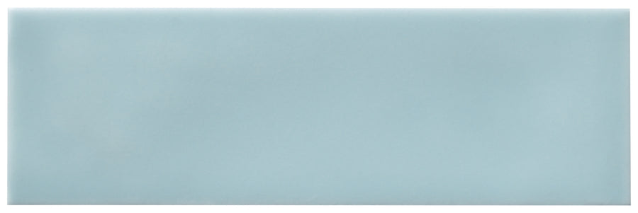 The Zephyr 2.5x8 Ceramic Tile is a smooth, rectangular, light blue tile with rounded edges and a glossy finish, inspired by Mediterranean style, shown against a white background.