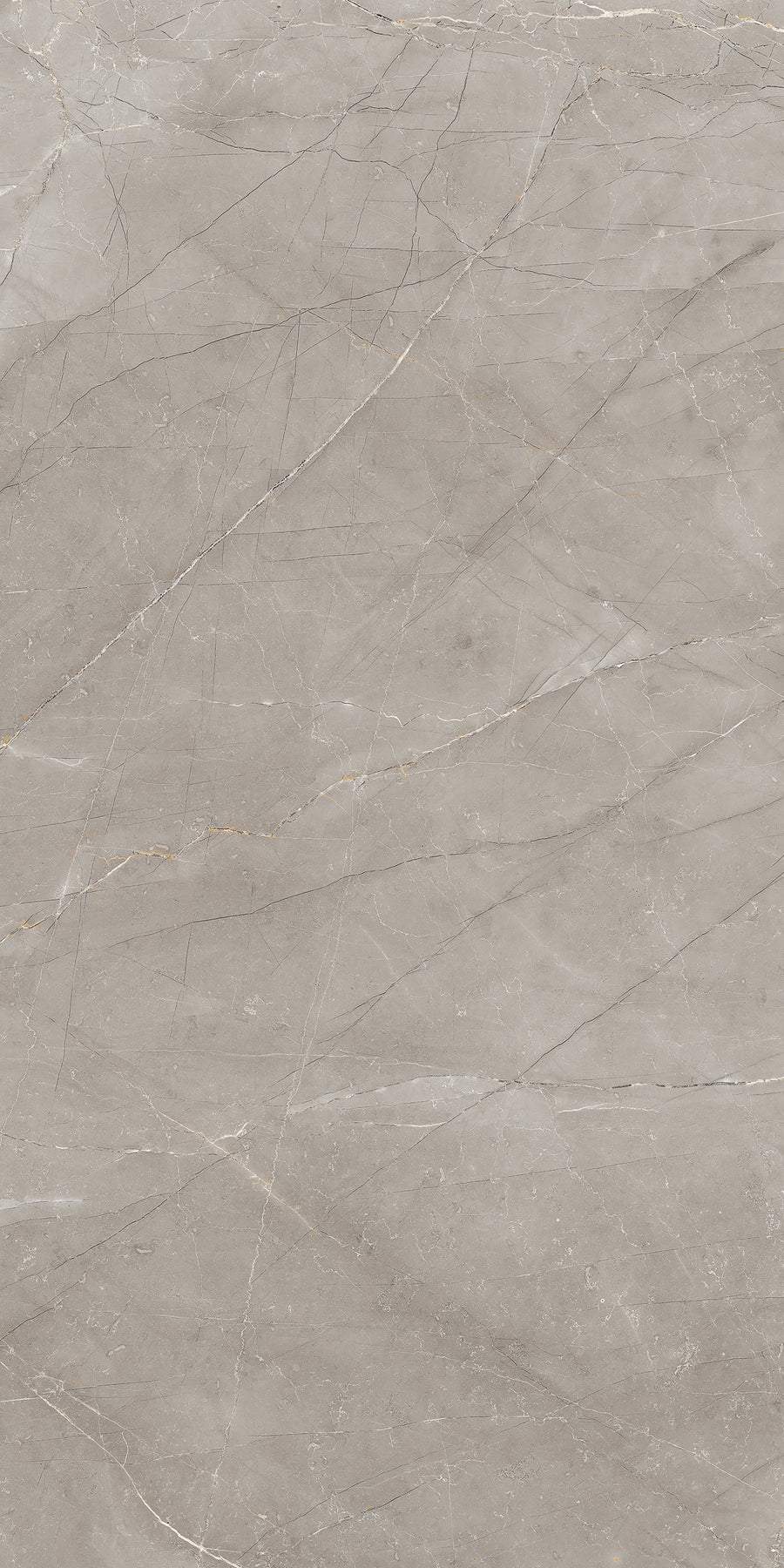 Light gray marble surface with subtle white and beige veins and fine natural cracks running diagonally and randomly across the stone, giving it a smooth, polished appearance.