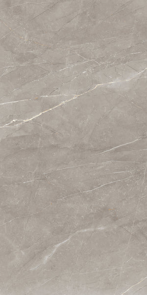 Light grey marble surface with subtle white and beige veining running diagonally across the stone, giving it a natural, polished, and elegant appearance.