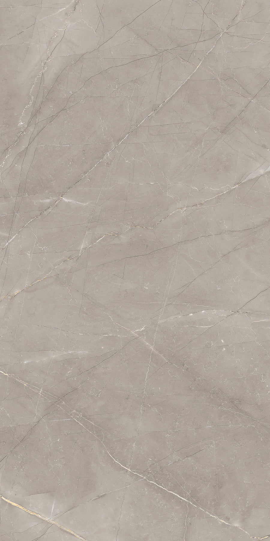 A close-up of a grey marble surface with thin, light-colored veins and subtle natural patterns running throughout, showcasing a smooth and polished texture.