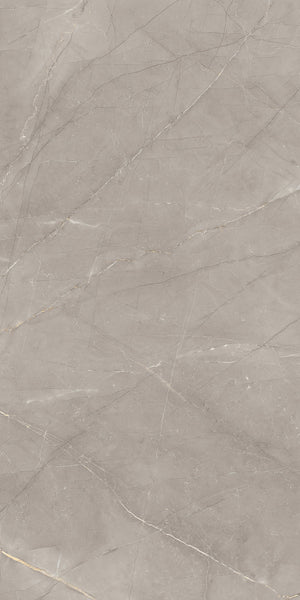 A close-up of a grey marble surface with thin, light-colored veins and subtle natural patterns running throughout, showcasing a smooth and polished texture.