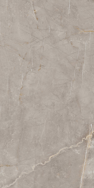Beige marble surface with subtle white and gold veining, displaying natural cracks and lines throughout the stone texture.