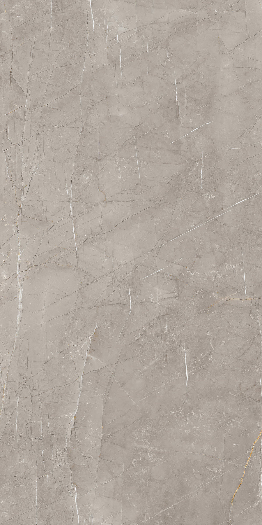 A close-up of a gray marble surface with subtle white and light brown veins and natural, uneven patterns running throughout. The texture appears smooth and polished.