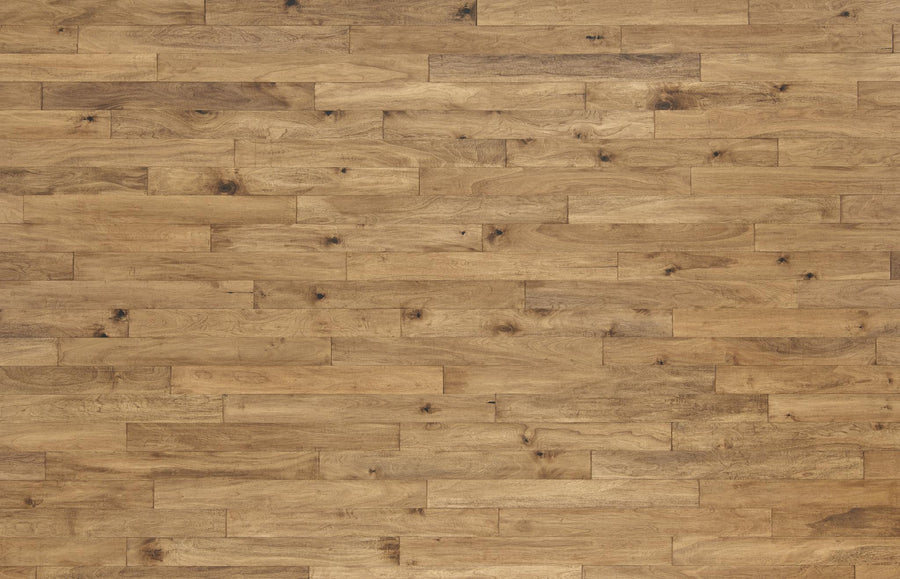 Wooden floor with long, narrow planks in varying shades of natural brown, showing distinct wood grain patterns and occasional knots. The surface has a matte finish and is evenly laid out with staggered seams.