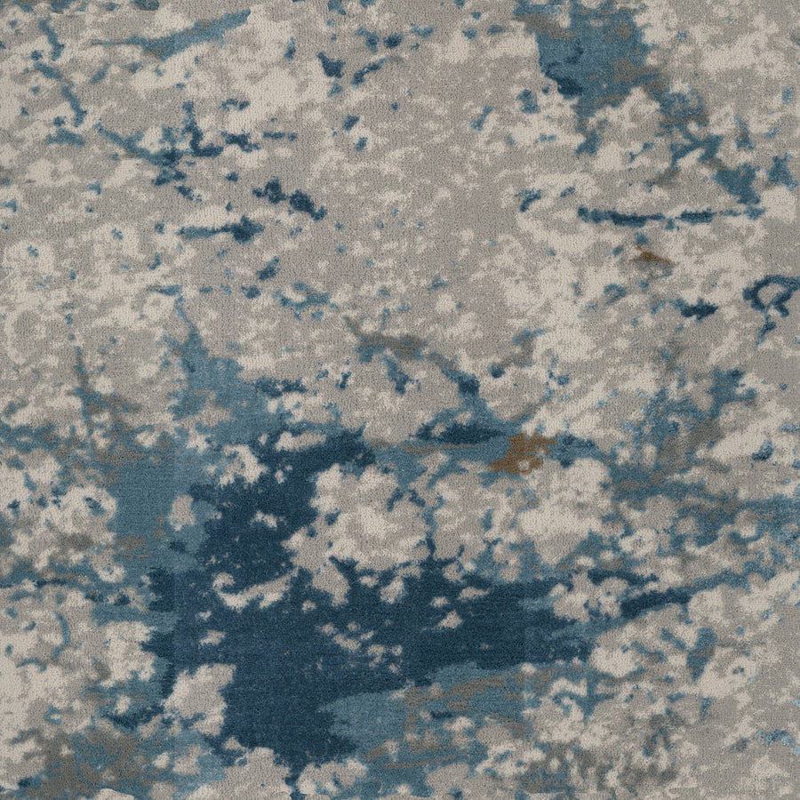 The Palisades On Trend Carpet features an abstract blue and gray watercolor pattern with subtle beige accents on a light gray surface, creating a premium marbled effect that adds artistic flair to any luxury space.