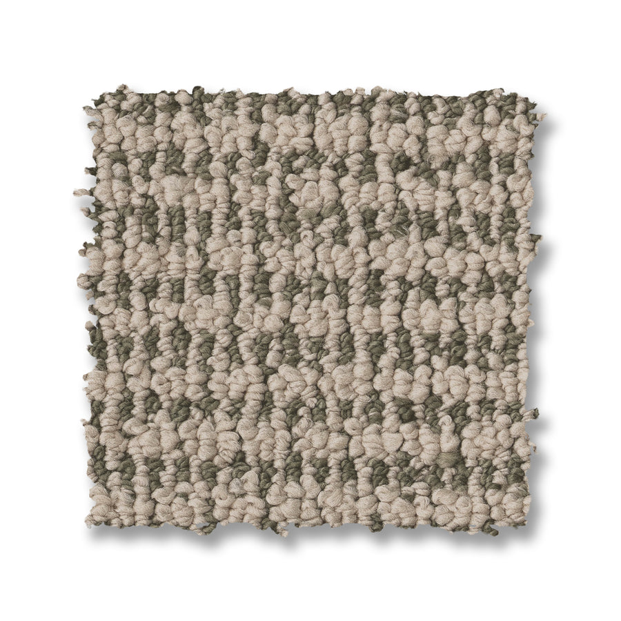 A square swatch of Laine On Trend Carpet displays alternating light beige and grayish-taupe looped fibers on a white background, highlighting the textured elegance of this premium flooring option.
