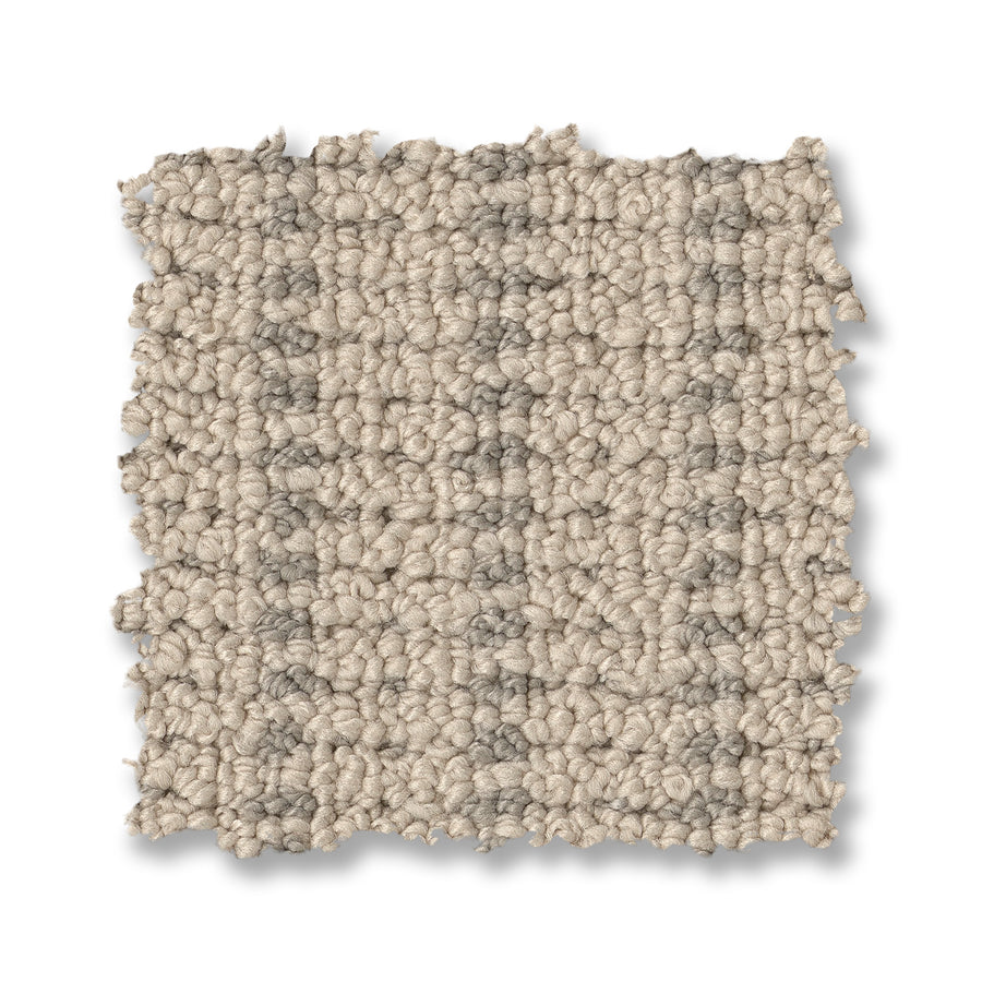 A square swatch of Laken On Trend Carpet in light beige has a loop pile, textured raised pattern, and visible fibers. Its uneven edges on a white background showcase the premium design of this carpet.