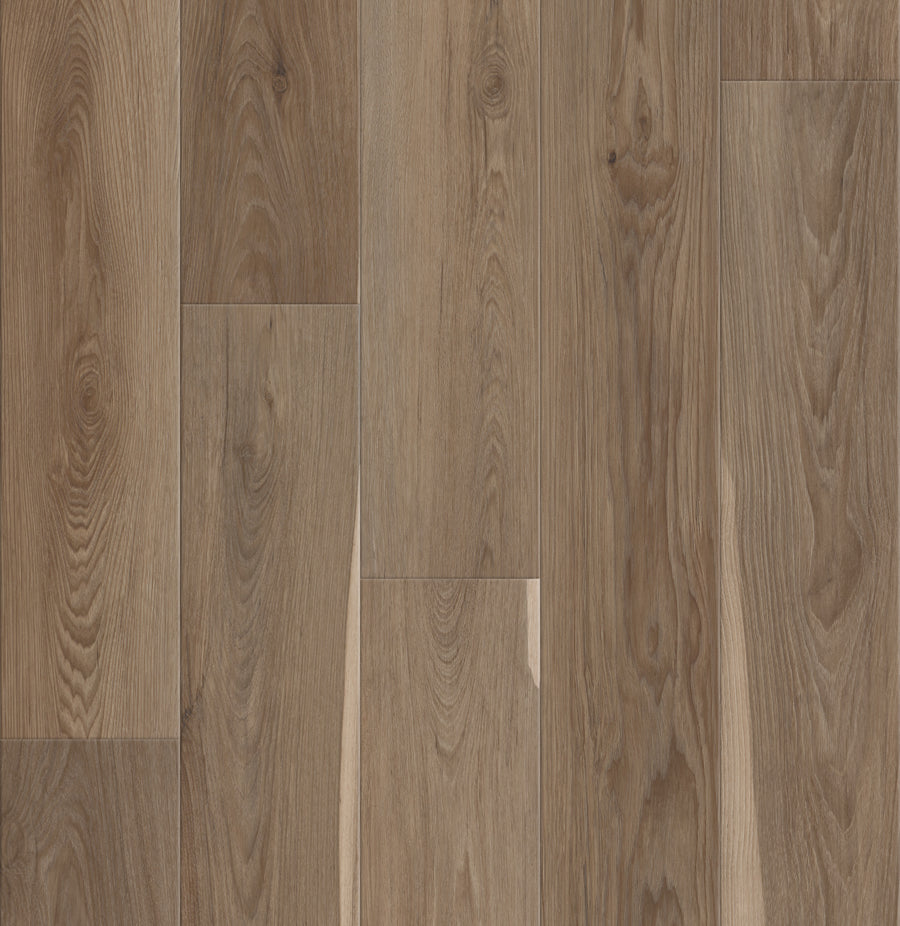 A close-up of Pantheon HD Plus 7" Vinyl shows its natural brown wood-look finish with distinct grain patterns and knots, arranged in a staggered, seamless layout that offers premium durability.