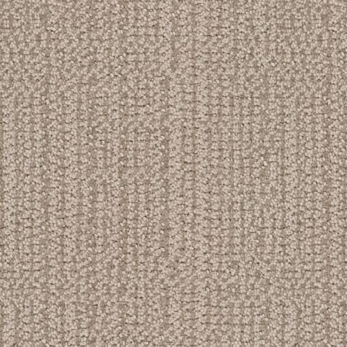 Close-up of Occasion On Trend Carpet in Parade color, showing its textured, light brown surface with a subtle, repeating linear pattern. Tightly woven fibers offer a soft, uniform, and luxurious appearance that’s stylish and modern.