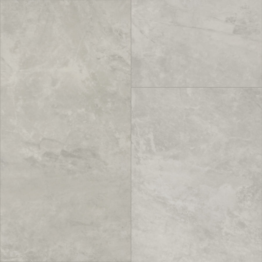 Paragon Tile Plus Vinyl features light grey stone-look tiles with subtle marbling and natural texture, arranged in a grid pattern with visible grout lines for a classic tile appearance.