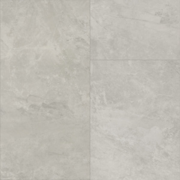 Paragon Tile Plus Vinyl features light grey stone-look tiles with subtle marbling and natural texture, arranged in a grid pattern with visible grout lines for a classic tile appearance.